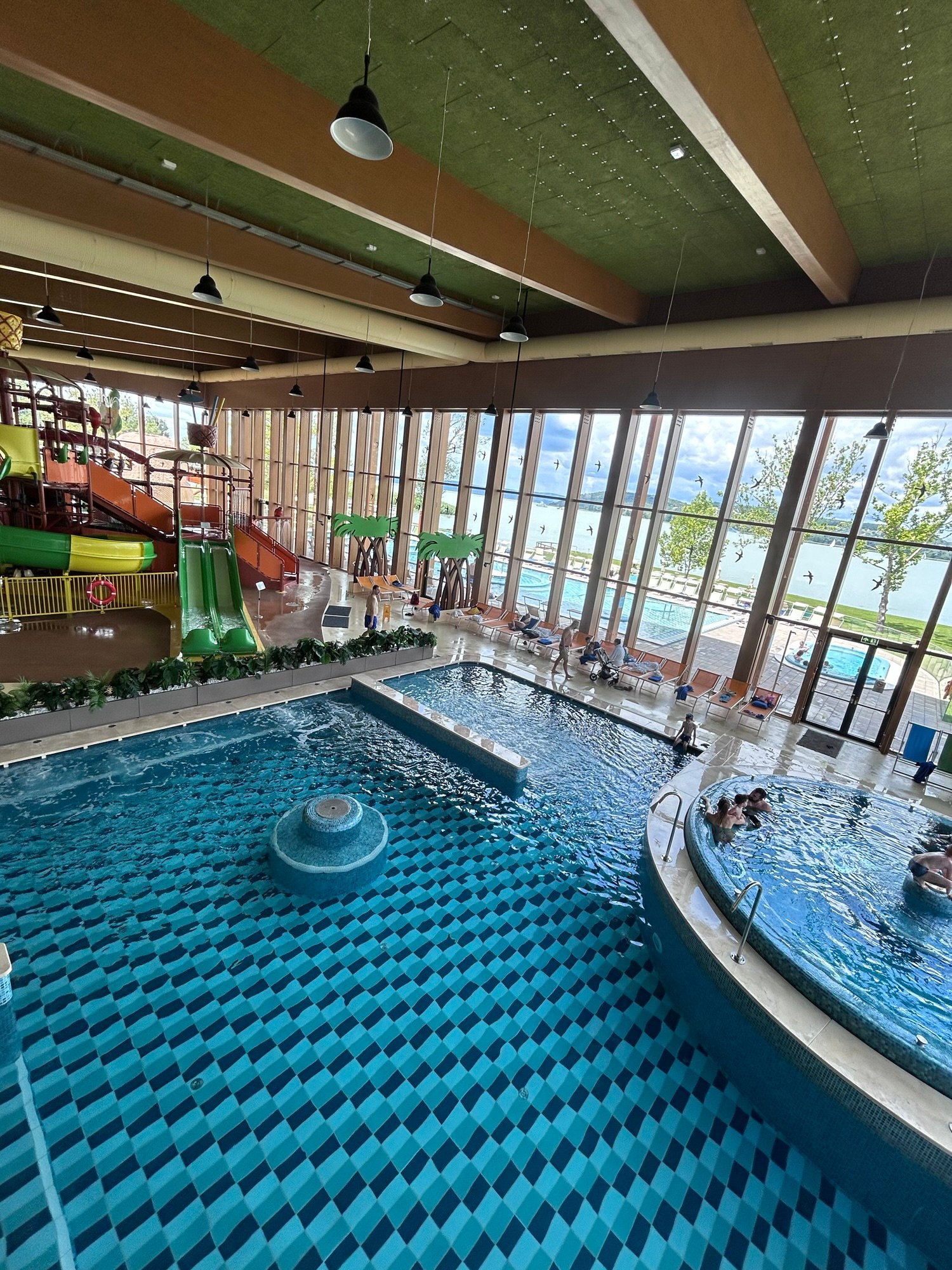 Indoor family pools and water slides at Mövenpick BalaLand Resort overlooking Lake Balaton, Hungary.