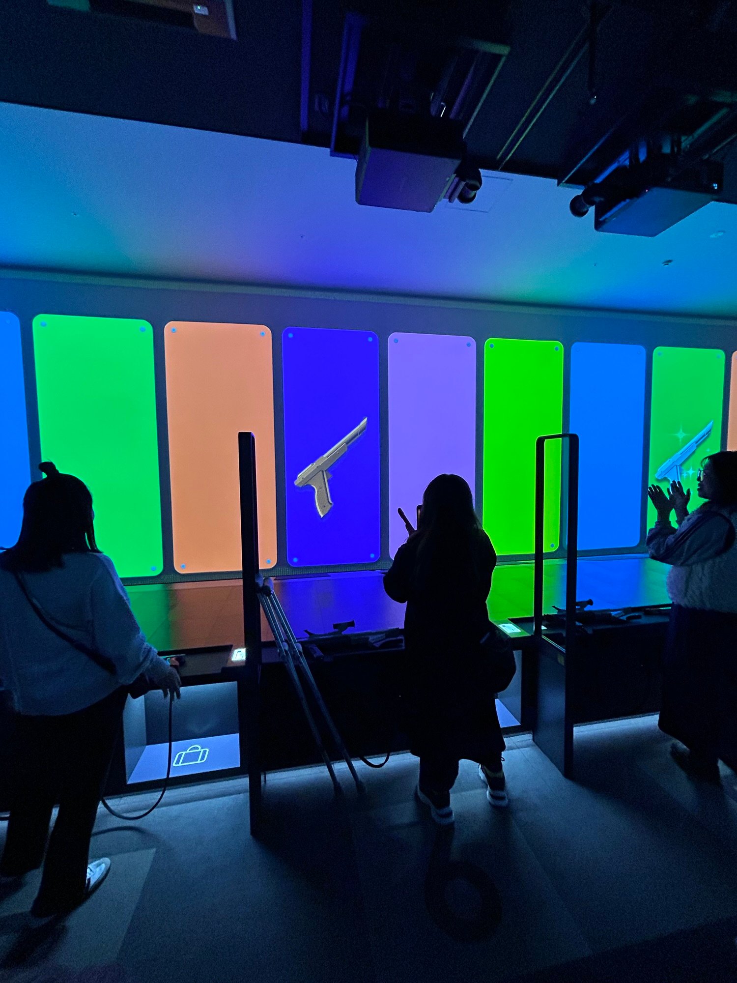 Visitors playing the interactive shooting games at the Nintendo Museum in Kyoto.