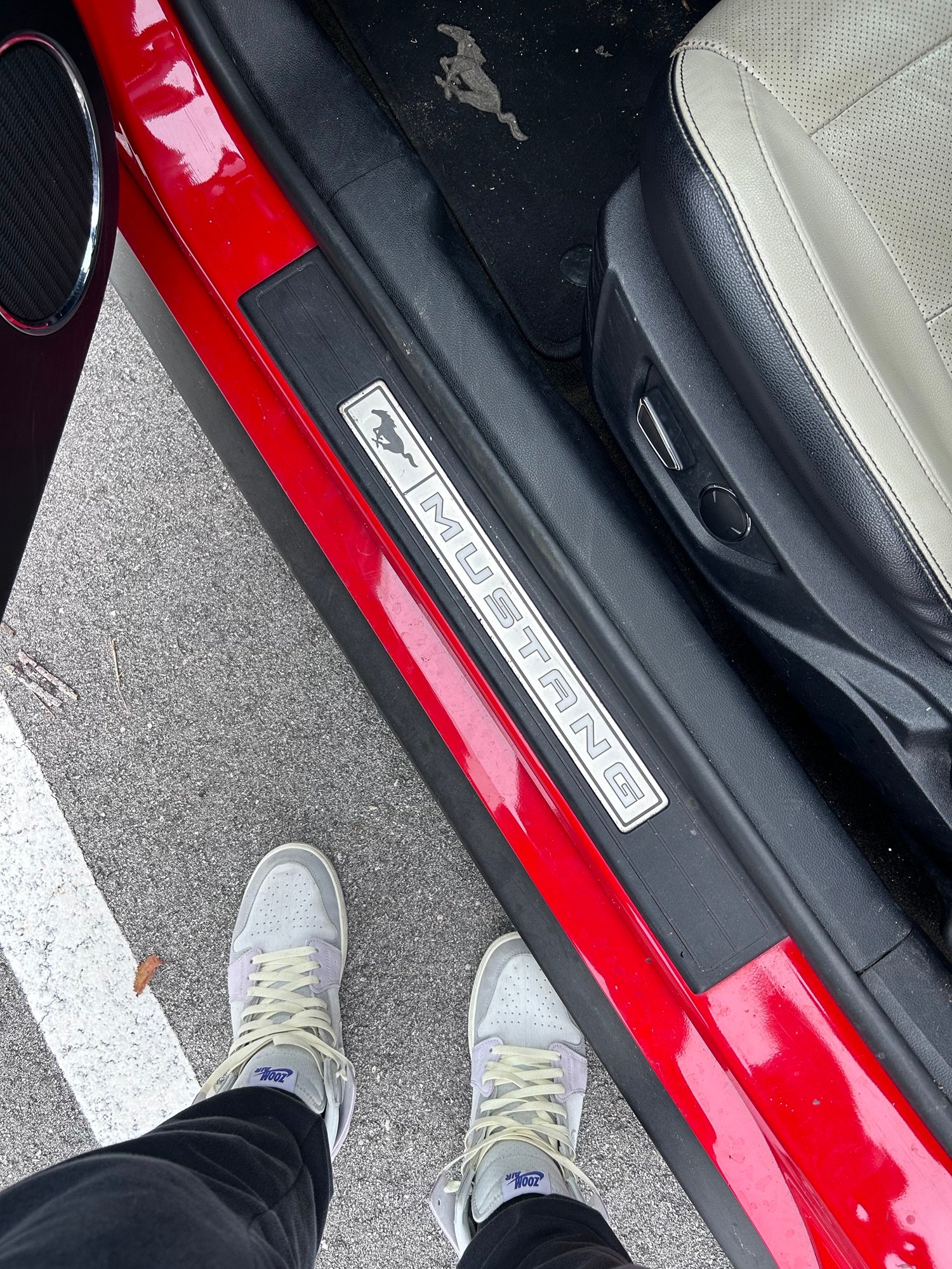 Starting our Florida road trip in a red Ford Mustang convertible