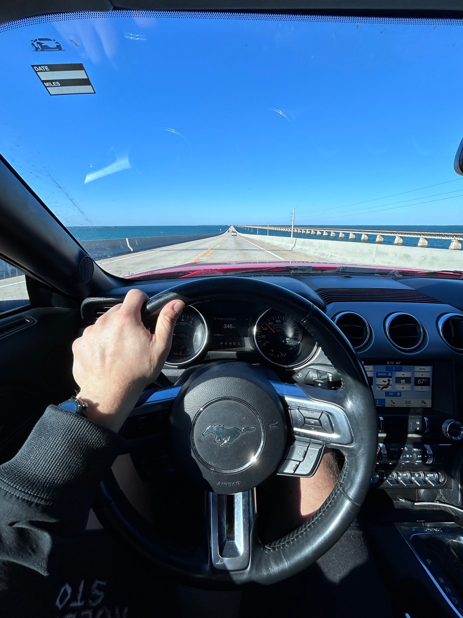 Driving the Overseas Highway through the Florida Keys in a Ford Mustang.