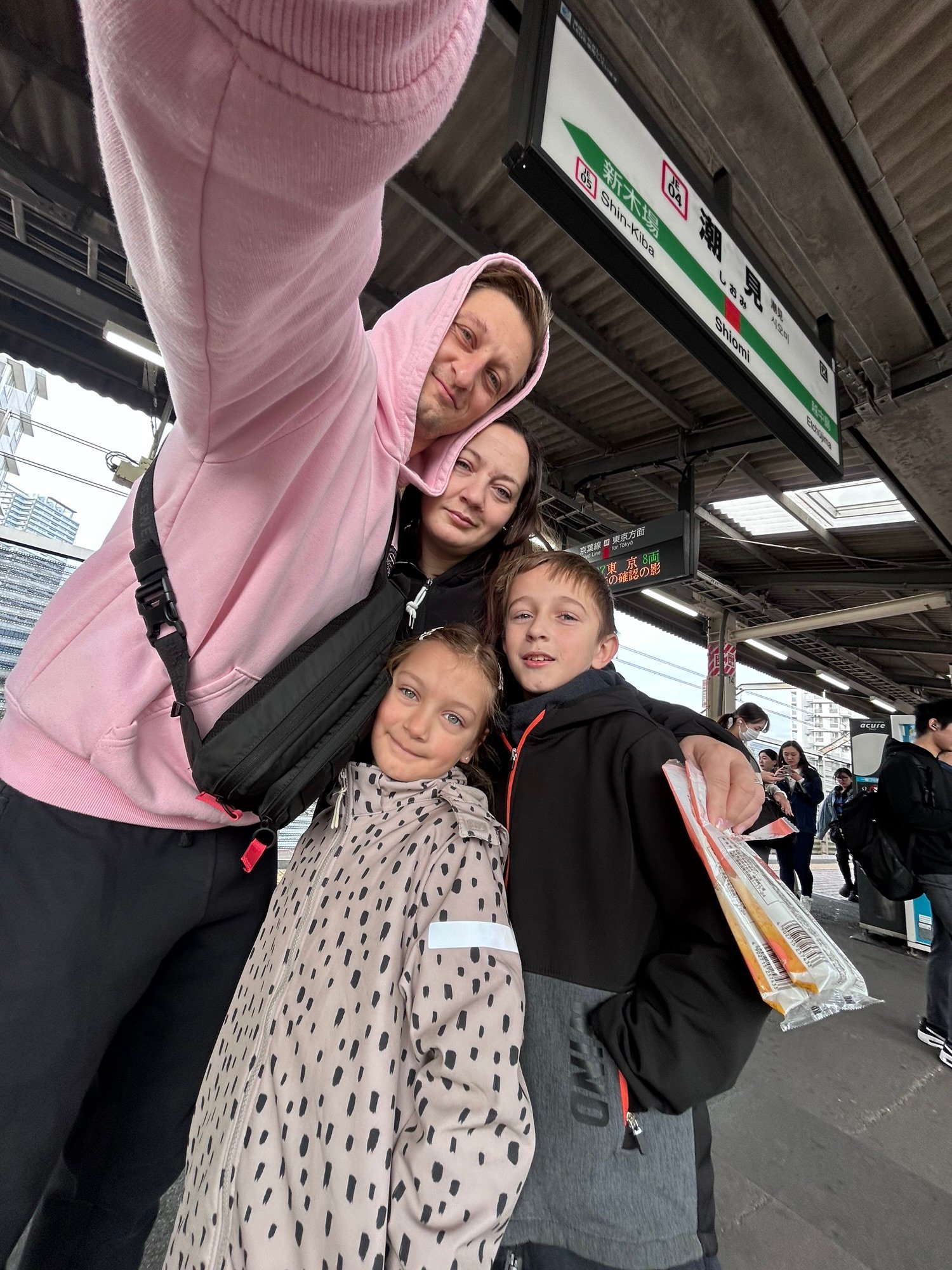 Family at Shiomi Station while getting around Tokyo with kids