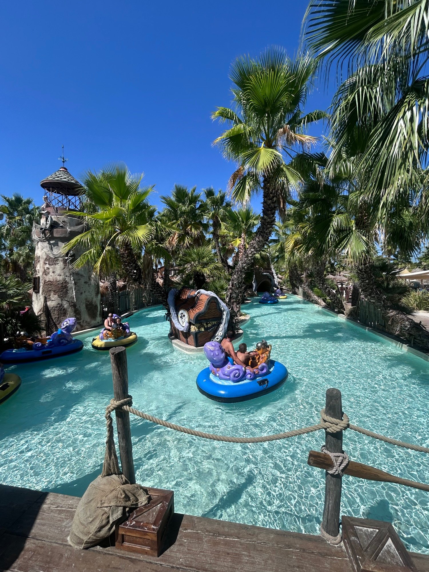 Kids riding motor-powered floaties on the Octopus attraction at Caribe Bay