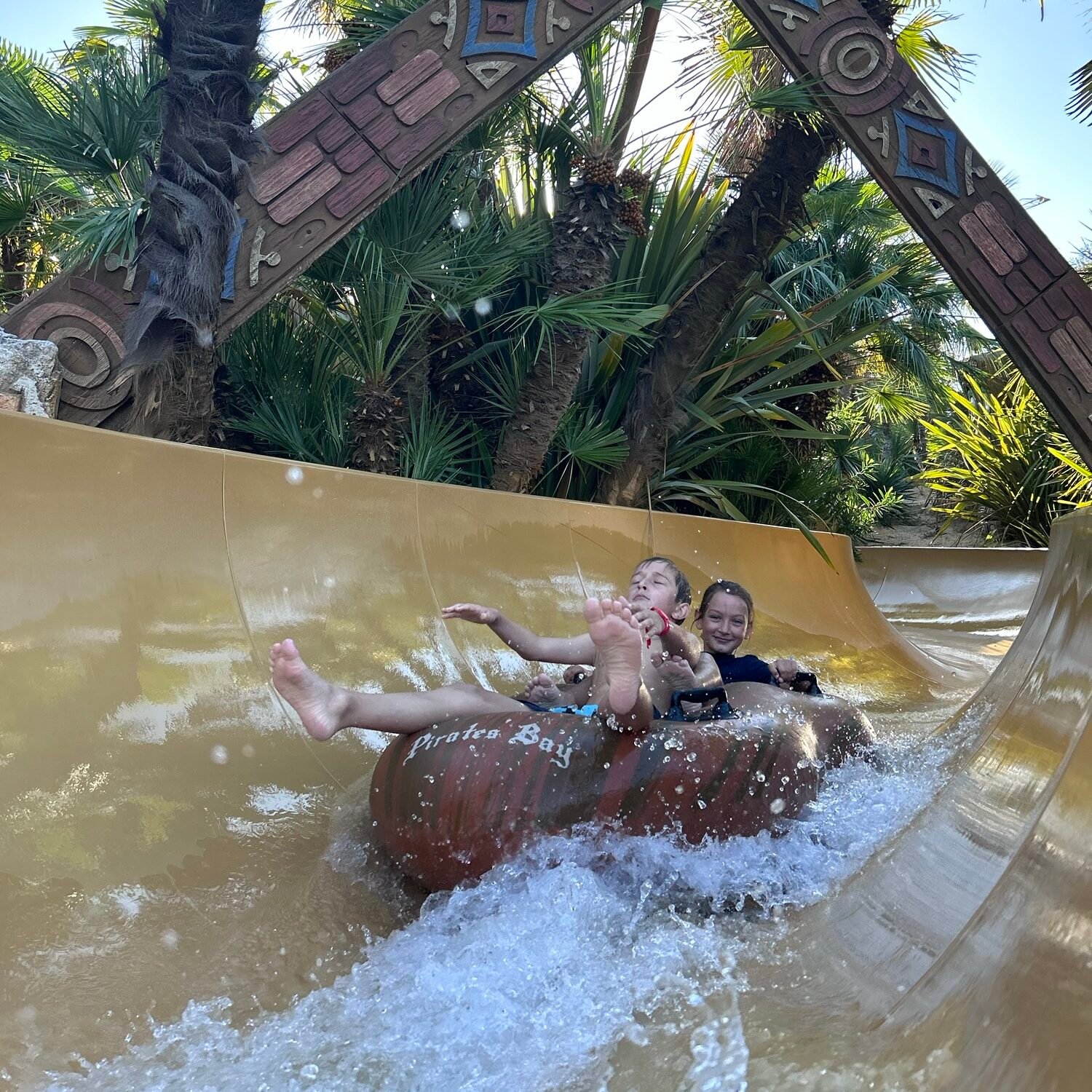 Caribe Bay with kids on a family water slide in Jesolo Italy