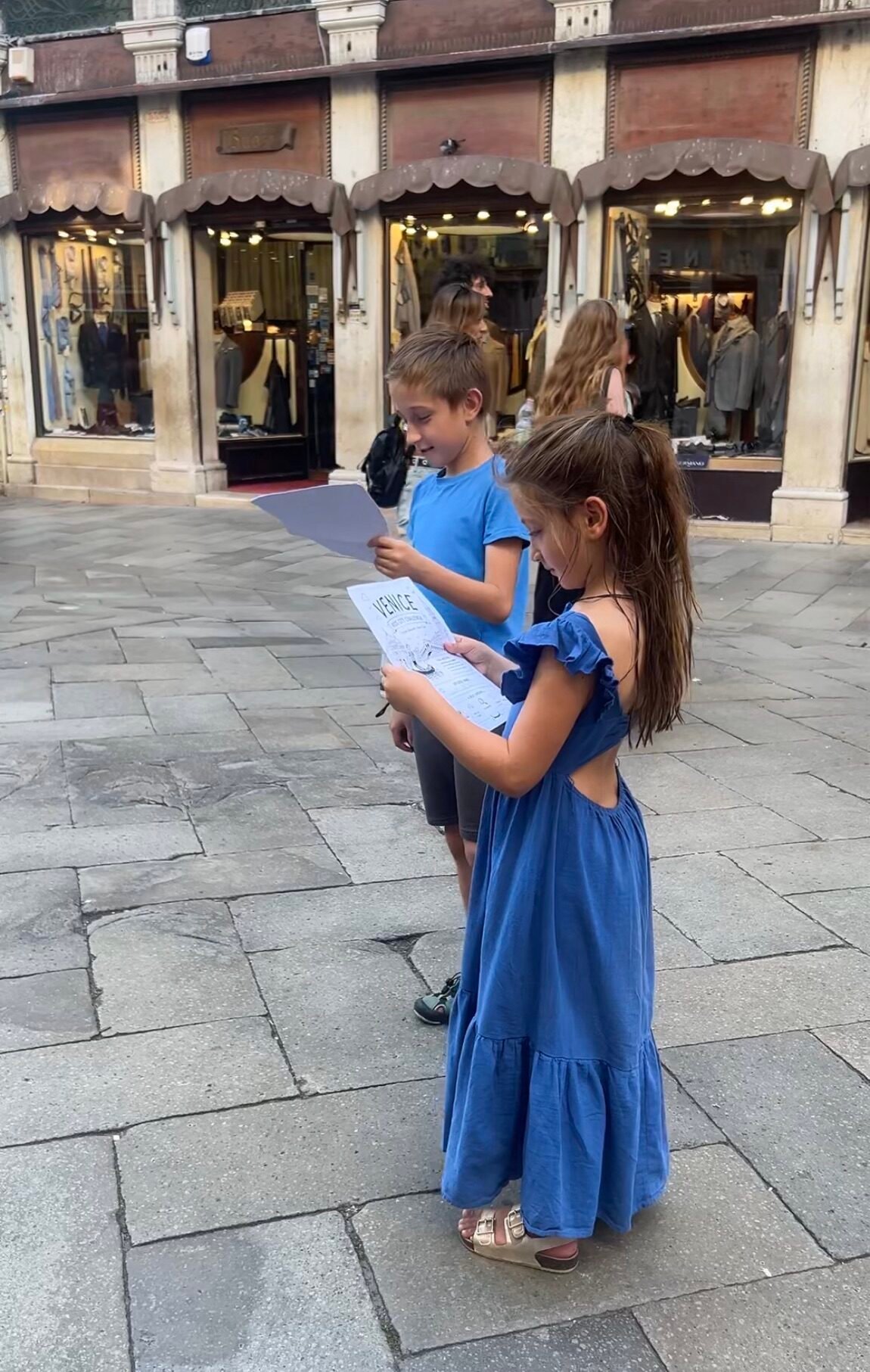 Kids completing their Venice city challenge while sightseeing