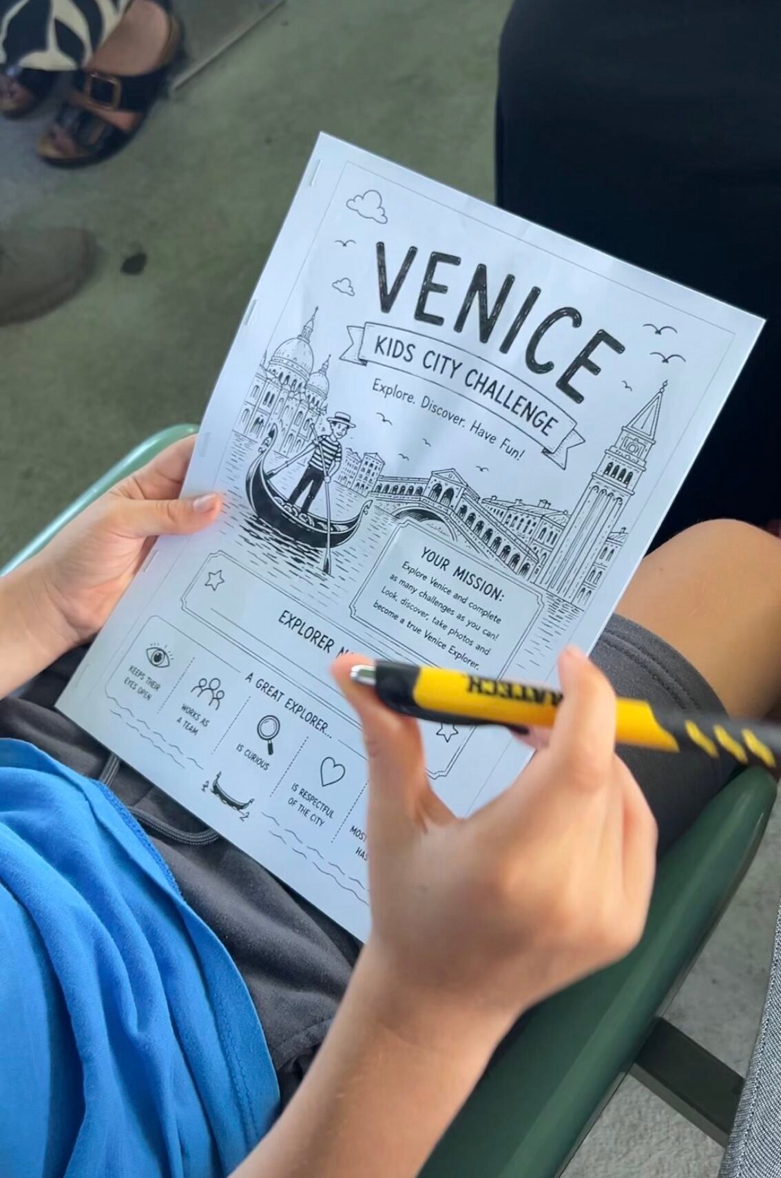 Child completing our Venice Kids Challenge during our family trip
