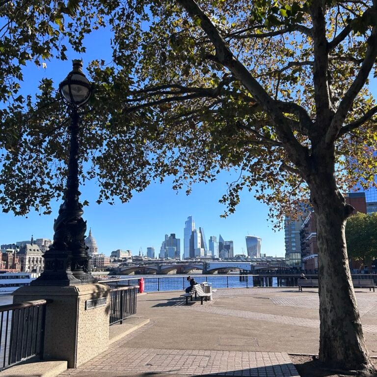 London tourist mistakes guide featuring a riverside walk along the Thames with the London skyline