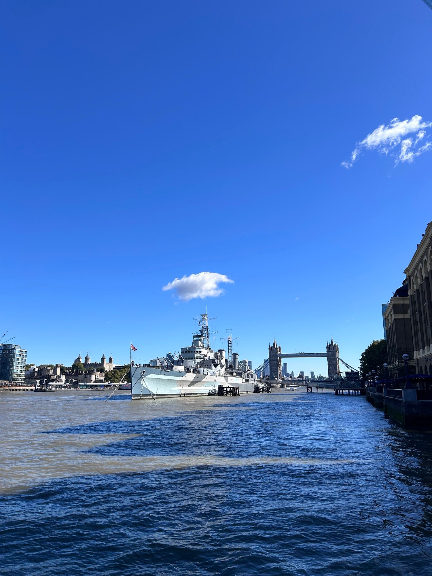 HMS Belfast and Tower Bridge seen from the Thames in London