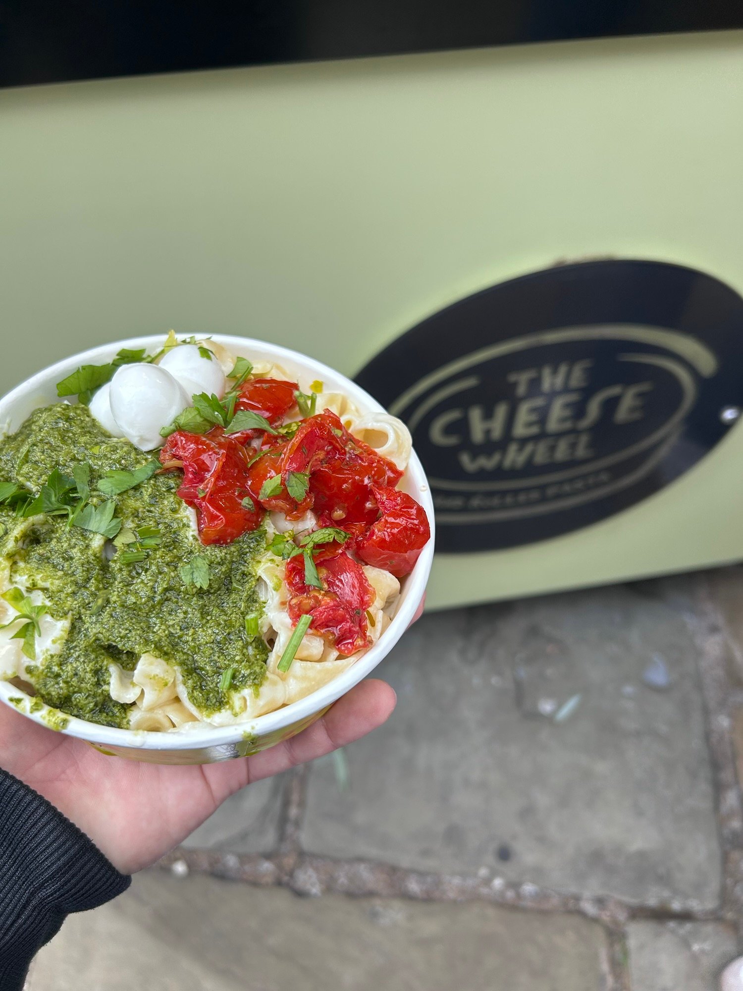 Fresh pasta from The Cheese Wheel at Camden Market with pesto and tomatoes.
